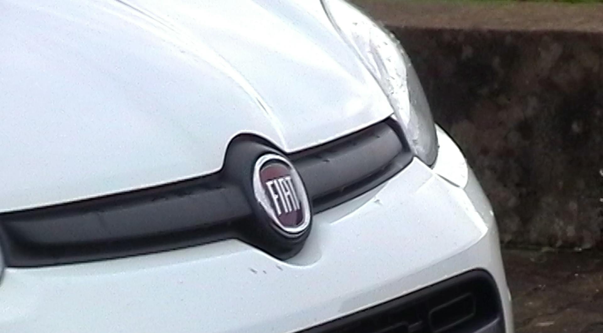 a close up of the front of a white car