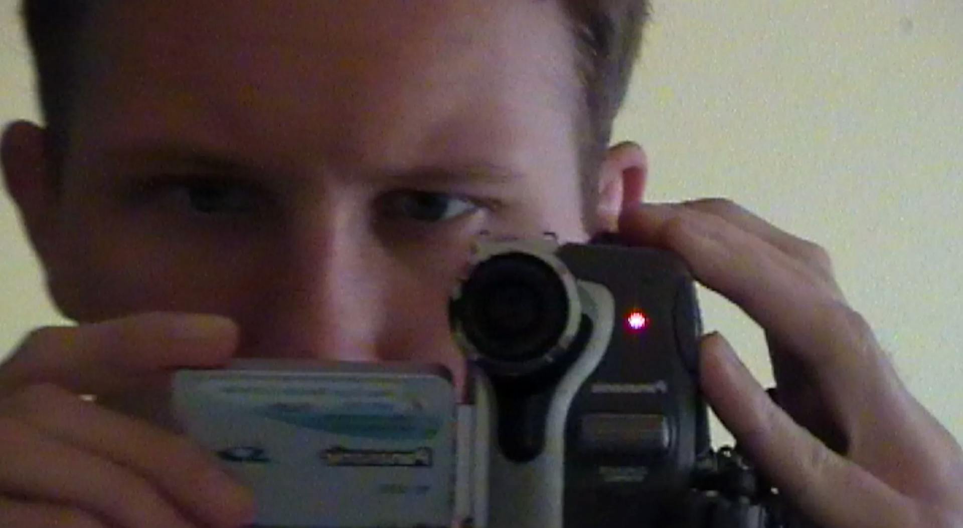 a man taking a picture of himself with a camera