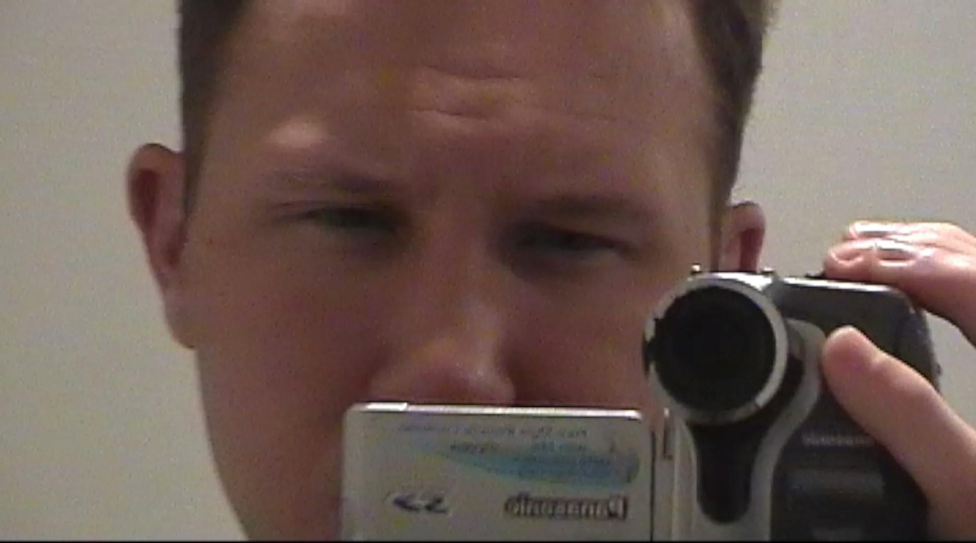 a man taking a picture of himself with a camera